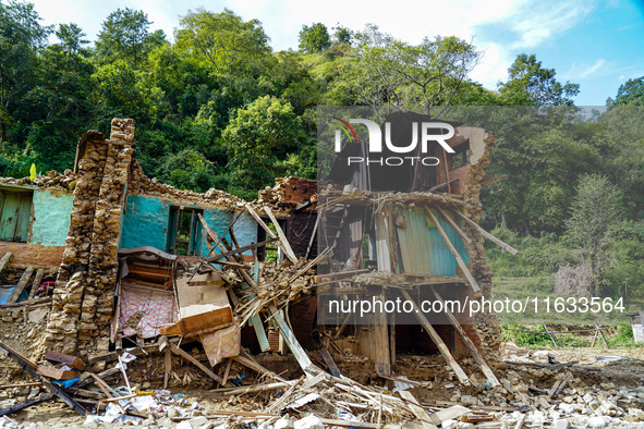 Salamdo River flooding damages homes in Patikharka of Kavrepalanchok District, Nepal, on October 3, 2024. Homes are severely damaged, with m...