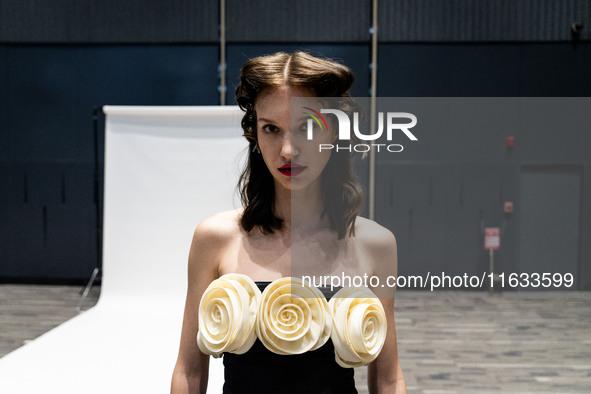 Models get ready backstage before walking on the runway during Day 2 of Bangkok International Fashion Week at Siam Paragon in Bangkok, Thail...