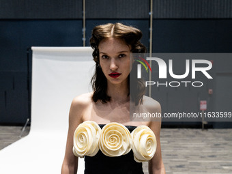 Models get ready backstage before walking on the runway during Day 2 of Bangkok International Fashion Week at Siam Paragon in Bangkok, Thail...