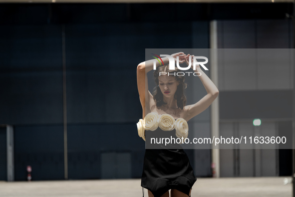 Models get ready backstage before walking on the runway during Day 2 of Bangkok International Fashion Week at Siam Paragon in Bangkok, Thail...