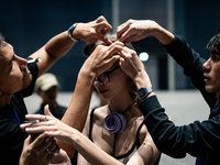 Models get ready backstage before walking on the runway during Day 2 of Bangkok International Fashion Week at Siam Paragon in Bangkok, Thail...