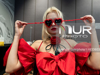 Models get ready backstage before walking on the runway during Day 2 of Bangkok International Fashion Week at Siam Paragon in Bangkok, Thail...