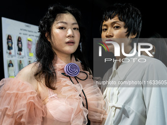 Models get ready backstage before walking on the runway during Day 2 of Bangkok International Fashion Week at Siam Paragon in Bangkok, Thail...