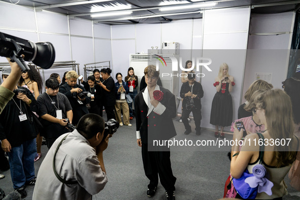 Models get ready backstage before walking on the runway during Day 2 of Bangkok International Fashion Week at Siam Paragon in Bangkok, Thail...