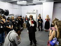 Models get ready backstage before walking on the runway during Day 2 of Bangkok International Fashion Week at Siam Paragon in Bangkok, Thail...