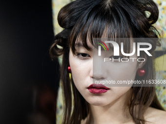 Models get ready backstage before walking on the runway during Day 2 of Bangkok International Fashion Week at Siam Paragon in Bangkok, Thail...