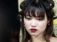 Models get ready backstage before walking on the runway during Day 2 of Bangkok International Fashion Week at Siam Paragon in Bangkok, Thail...