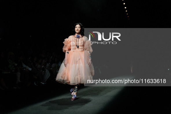 Models showcase creations by TandT on the runway during Day 2 of Bangkok International Fashion Week at Siam Paragon in Bangkok, Thailand, on...