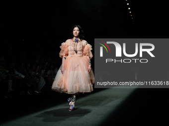 Models showcase creations by TandT on the runway during Day 2 of Bangkok International Fashion Week at Siam Paragon in Bangkok, Thailand, on...