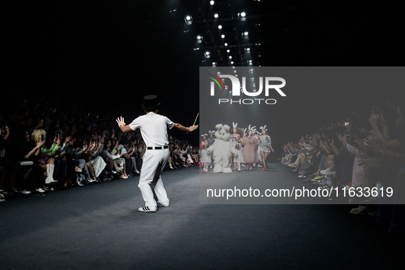 Thanawut Thanasarnvimon ''Nook'', the designer of TandT, concludes his runway show with magic during Day 2 of Bangkok International Fashion...