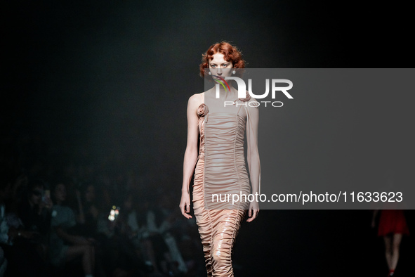 Models showcase creations by TandT on the runway during Day 2 of Bangkok International Fashion Week at Siam Paragon in Bangkok, Thailand, on...