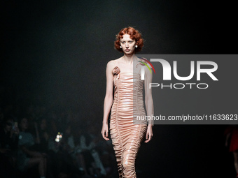 Models showcase creations by TandT on the runway during Day 2 of Bangkok International Fashion Week at Siam Paragon in Bangkok, Thailand, on...