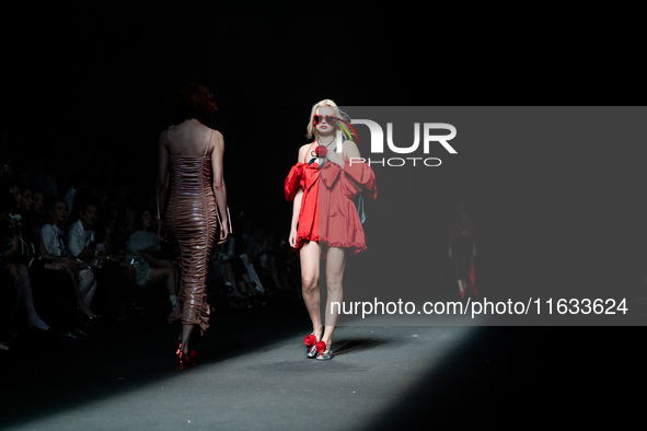 Models showcase creations by TandT on the runway during Day 2 of Bangkok International Fashion Week at Siam Paragon in Bangkok, Thailand, on...