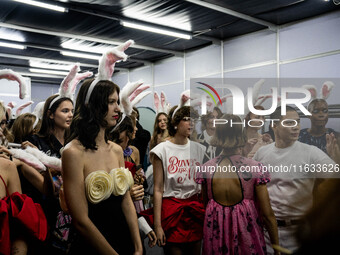 Models wear bunny ears and celebrate after showcasing creations by TandT on the runway during Day 2 of Bangkok International Fashion Week at...