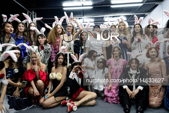 Models wear bunny ears and celebrate after showcasing creations by TandT on the runway during Day 2 of Bangkok International Fashion Week at...