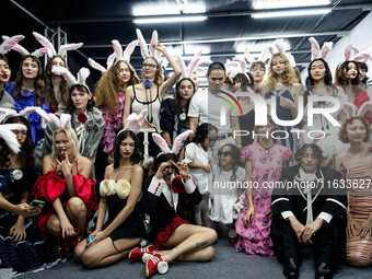 Models wear bunny ears and celebrate after showcasing creations by TandT on the runway during Day 2 of Bangkok International Fashion Week at...