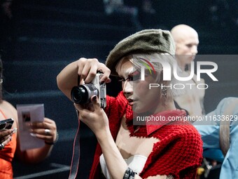 Shogun, a contestant on the upcoming third season of Drag Race Thailand, takes a photo on the runway during Day 2 of Bangkok International F...