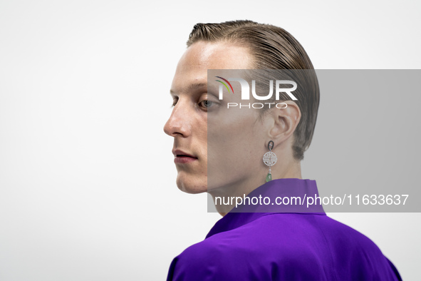 Models get ready backstage before walking on the runway during Day 2 of Bangkok International Fashion Week at Siam Paragon in Bangkok, Thail...