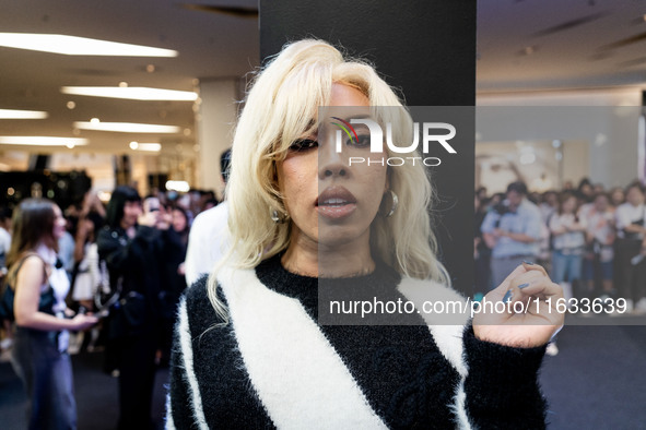 A Thai influencer greets fans during Day 2 of Bangkok International Fashion Week at Siam Paragon in Bangkok, Thailand, on October 3, 2024. 