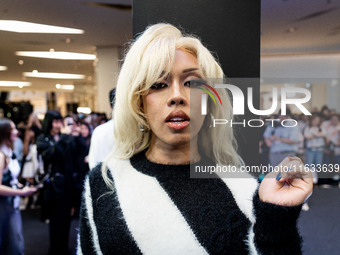 A Thai influencer greets fans during Day 2 of Bangkok International Fashion Week at Siam Paragon in Bangkok, Thailand, on October 3, 2024. (