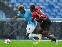 Fisayo Dele-Bashiru of SS Lazio and Moise Bombito of OCG Nice compete for the ball during the UEFA Europa League 2024/25 League Phase MD2 ma...