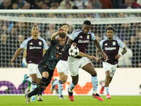 Jhon Duran centre-forward of Aston Villa and Colombia and Joshua Kimmich central midfield of Bayern Munich and Germany compete for the ball...