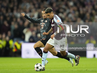 Morgan Rogers attacking midfield of Aston Villa and England and Leroy Sane right winger of Bayern Munich and Germany compete for the ball du...