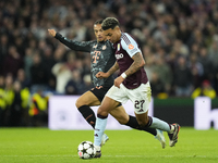 Morgan Rogers attacking midfield of Aston Villa and England and Leroy Sane right winger of Bayern Munich and Germany compete for the ball du...