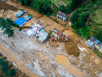 The aerial view shows the flood-affected areas of Patikharka, Kavrepalanchok District, Nepal, on October 3, 2024. Homes are severely damaged...