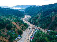 The aerial view shows the flood-affected areas of Patikharka, Kavrepalanchok District, Nepal, on October 3, 2024. Homes are severely damaged...