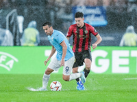 Tom Louchet of OGC Nice and Pedro of SS Lazio compete for the ball during the UEFA Europa League 2024/25 League Phase MD2 match between SS L...