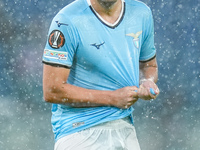 Pedro of SS Lazio wrings out his rain-soaked shirt during the UEFA Europa League 2024/25 League Phase MD2 match between SS Lazio and OGC Nic...