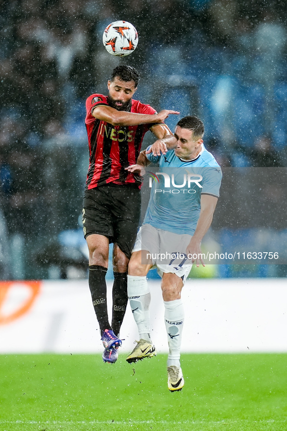 Ali Abdi of OGC Nice and Adam Marusic of SS Lazio jump for the ball during the UEFA Europa League 2024/25 League Phase MD2 match between SS...