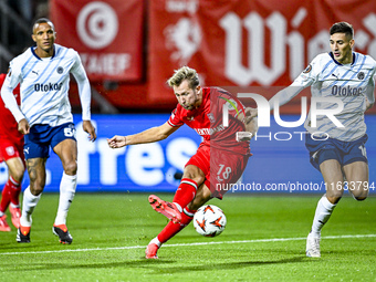 FC Twente midfielder Michel Vlap and Fenerbahce defender Mert Muldur play during the match between Twente and Fenerbahce at the Grolsch Vest...