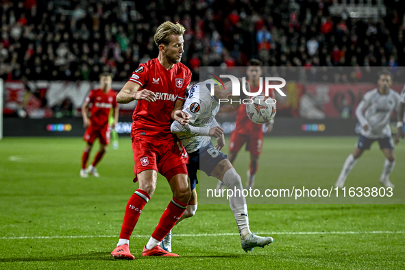 FC Twente midfielder Michel Vlap and Fenerbahce midfielder Sebastian Szymanski play during the match between Twente and Fenerbahce at the Gr...