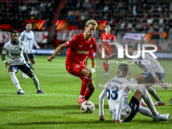 FC Twente midfielder Michel Vlap, Fenerbahce forward Dusan Tadic, and Fenerbahce midfielder Sebastian Szymanski participate during the match...