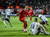 FC Twente midfielder Michel Vlap, Fenerbahce forward Dusan Tadic, and Fenerbahce midfielder Sebastian Szymanski participate during the match...