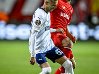 Fenerbahce midfielder Sebastian Szymanski and FC Twente midfielder Youri Regeer play during the match between Twente and Fenerbahce at the G...