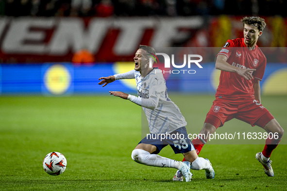 Fenerbahce midfielder Sebastian Szymanski and FC Twente midfielder Youri Regeer play during the match between Twente and Fenerbahce at the G...