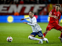 Fenerbahce midfielder Sebastian Szymanski and FC Twente midfielder Youri Regeer play during the match between Twente and Fenerbahce at the G...