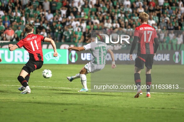 LOIZOS LOIZOU of Omonoia FC shoots the ball while GISLI GOTTSKALK THORDARSON and ARI SIGURPALSSON of Vikingur Reykjavik watch, in Nicosia, C...