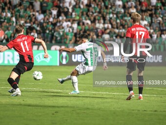 LOIZOS LOIZOU of Omonoia FC shoots the ball while GISLI GOTTSKALK THORDARSON and ARI SIGURPALSSON of Vikingur Reykjavik watch, in Nicosia, C...