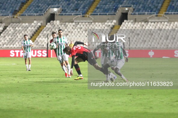 Dadi Berg Jonsson of Vikingur Reykjavik tries to dribble Alpha Diounkou of Omonoia FC in Nicosia, Cyprus, on October 3, 2024. Omonoia FC pla...