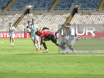 Dadi Berg Jonsson of Vikingur Reykjavik tries to dribble Alpha Diounkou of Omonoia FC in Nicosia, Cyprus, on October 3, 2024. Omonoia FC pla...