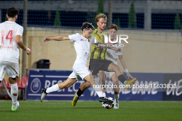 Kayden Farrugia of Valletta vies for the ball with Pietu Hautakanagas of Honka during the UEFA Youth League soccer match between Valletta an...