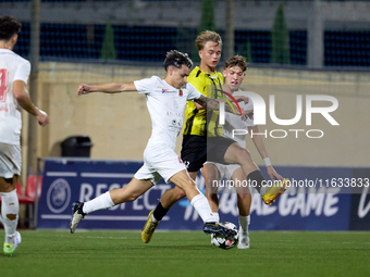 Kayden Farrugia of Valletta vies for the ball with Pietu Hautakanagas of Honka during the UEFA Youth League soccer match between Valletta an...