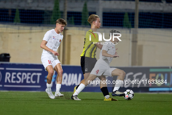 In Ta' Qali, Malta, on October 2, 2024, Kayden Farrugia of Valletta is challenged by Pietu Hautakanagas of Honka during the UEFA Youth Leagu...