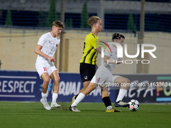 In Ta' Qali, Malta, on October 2, 2024, Kayden Farrugia of Valletta is challenged by Pietu Hautakanagas of Honka during the UEFA Youth Leagu...