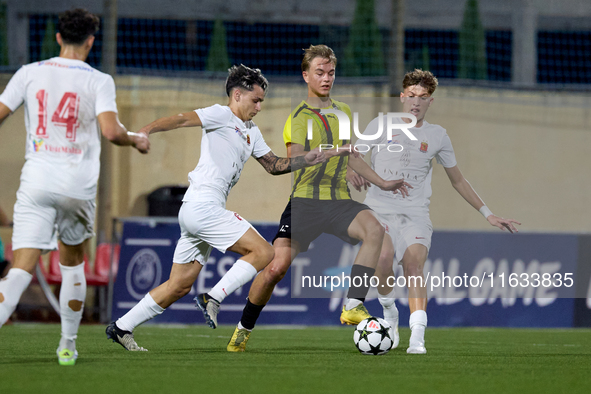 Kayden Farrugia of Valletta vies for the ball with Pietu Hautakanagas of Honka during the UEFA Youth League soccer match between Valletta an...