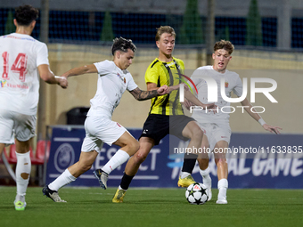 Kayden Farrugia of Valletta vies for the ball with Pietu Hautakanagas of Honka during the UEFA Youth League soccer match between Valletta an...